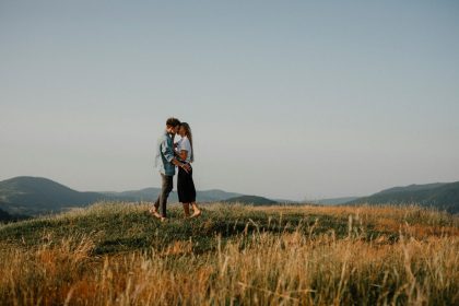 scenic engagement photo session on a hill
