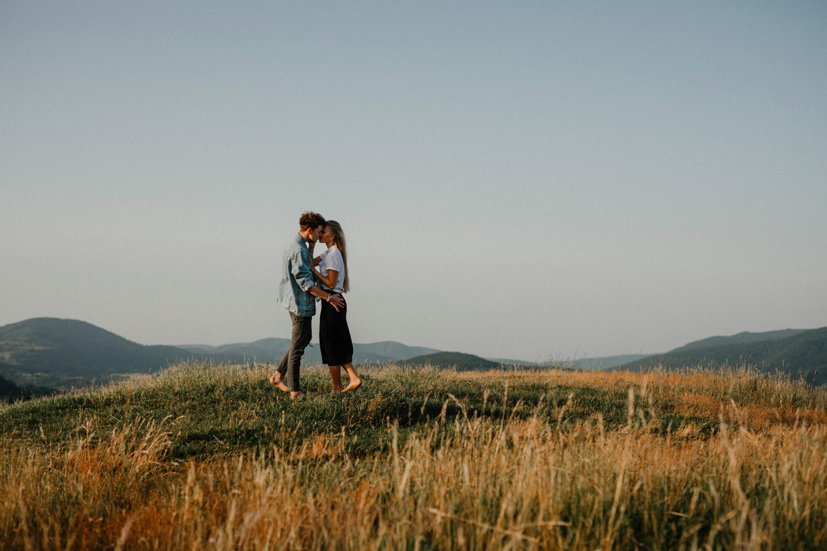 scenic engagement photo session on a hill