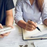 newlyweds doing their financial planning